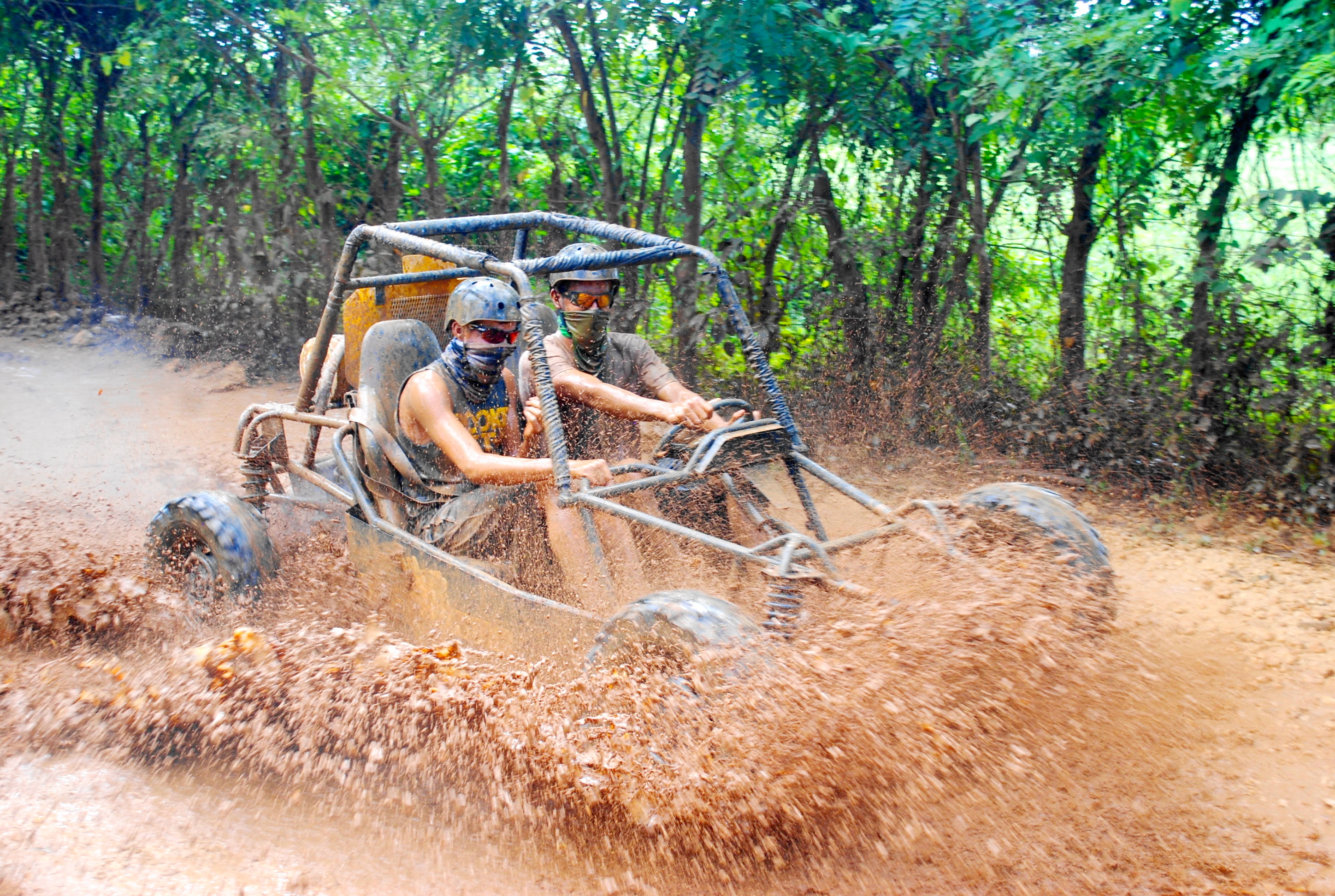 Dominican Republic driving go kart in the mud